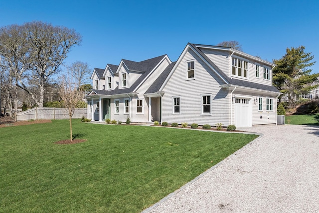 cape cod house with a front lawn and roof with shingles