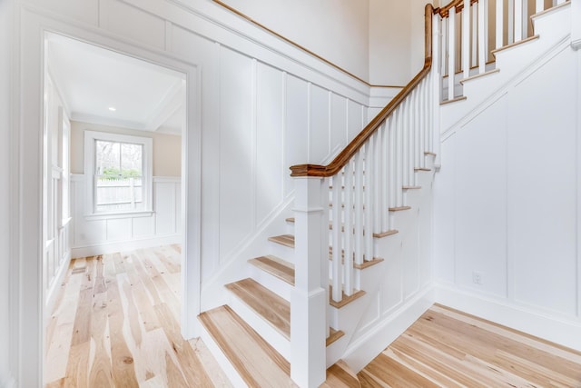 additional living space featuring visible vents, recessed lighting, lofted ceiling, light wood finished floors, and baseboards