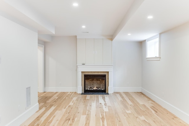 half bath featuring vanity, marble finish floor, baseboards, and toilet
