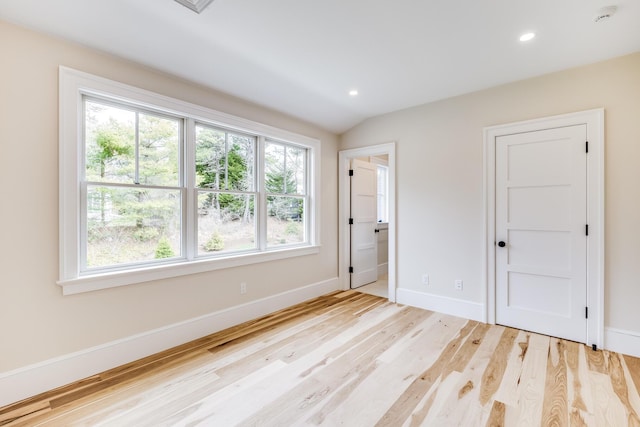 unfurnished bedroom with light wood finished floors, baseboards, and recessed lighting