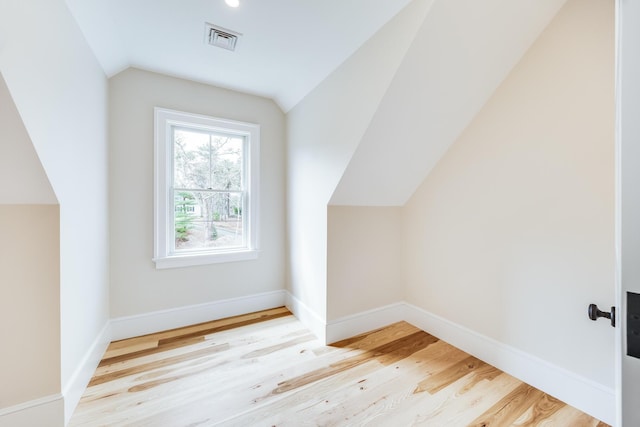 unfurnished room with wood finished floors, baseboards, and recessed lighting