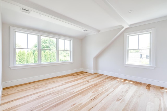 bonus room featuring beam ceiling and light hardwood / wood-style floors