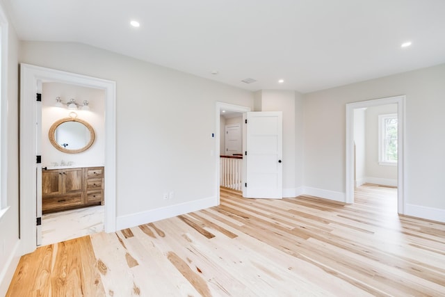 unfurnished bedroom featuring baseboards, light wood-type flooring, and recessed lighting