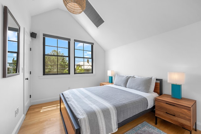 350 Bradford St Unit U5, Provincetown, MA 02657 - bedroom with lofted ceiling, light wood-style flooring, and baseboards
