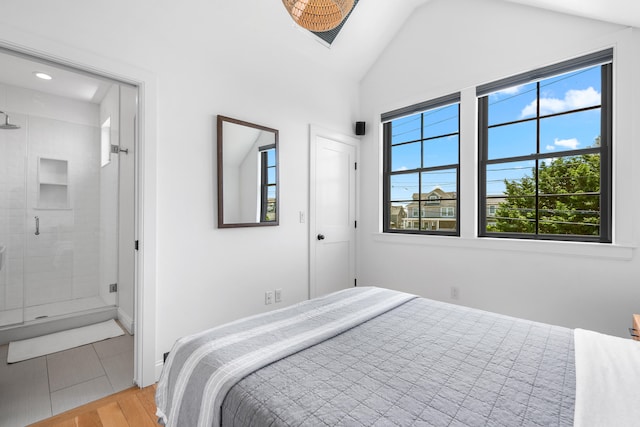 350 Bradford St Unit U5, Provincetown, MA 02657 - bedroom featuring lofted ceiling, light wood-style flooring, and ensuite bathroom
