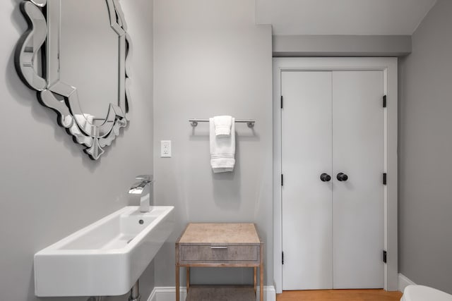 350 Bradford St Unit U5, Provincetown, MA 02657 - bathroom with a sink, toilet, and baseboards