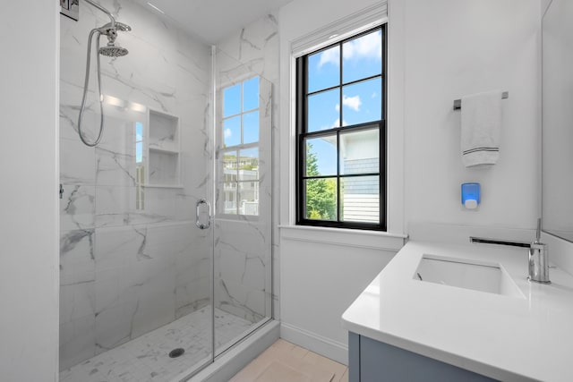 350 Bradford St Unit U5, Provincetown, MA 02657 - full bathroom with a marble finish shower, vanity, and baseboards