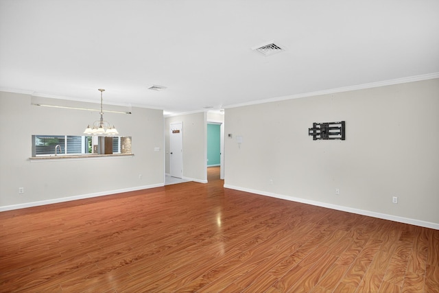 87 Susanna Dr, Brewster, MA 02631 - empty room featuring ornamental molding, a chandelier, and wood finished floors