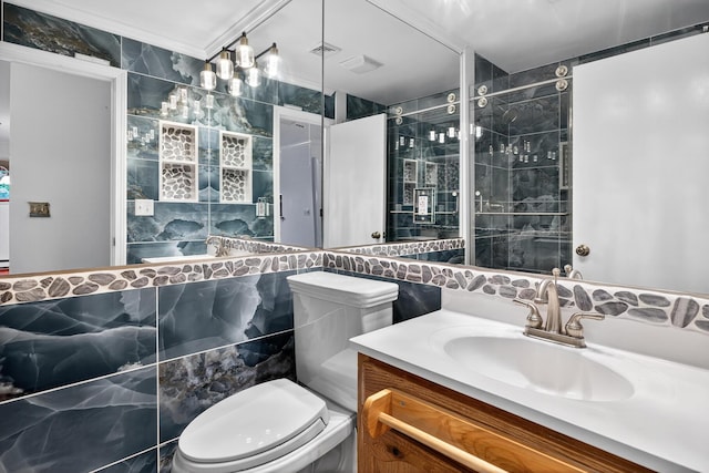 87 Susanna Dr, Brewster, MA 02631 - bathroom with tile walls, vanity, and ornamental molding
