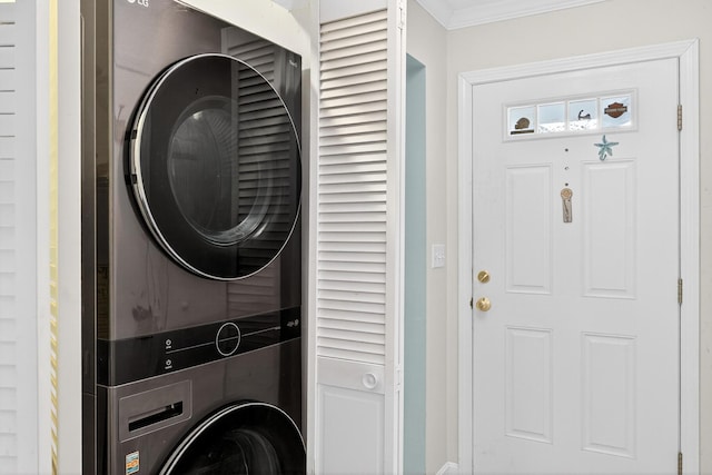 87 Susanna Dr, Brewster, MA 02631 - washroom featuring estacked washer and dryer and ornamental molding