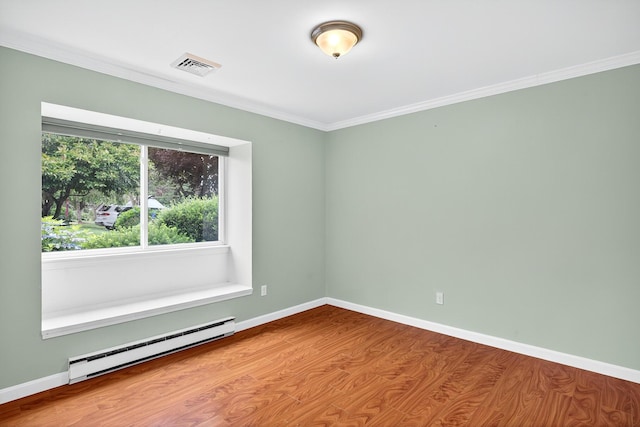 87 Susanna Dr, Brewster, MA 02631 - spare room featuring baseboard heating, wood finished floors, and crown molding