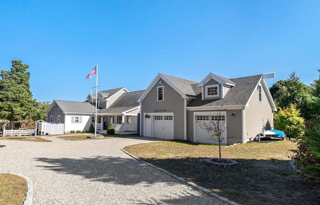 view of front of house with a garage and a front lawn