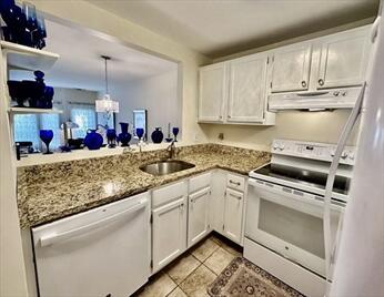 4 Westcliff Dr Unit 4, Cedarville, MA 02360 - kitchen with white cabinetry, under cabinet range hood, a sink, and white appliances