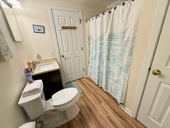 4 Westcliff Dr Unit 4, Cedarville, MA 02360 - bathroom featuring a shower with shower curtain, wood finished floors, toilet, and vanity