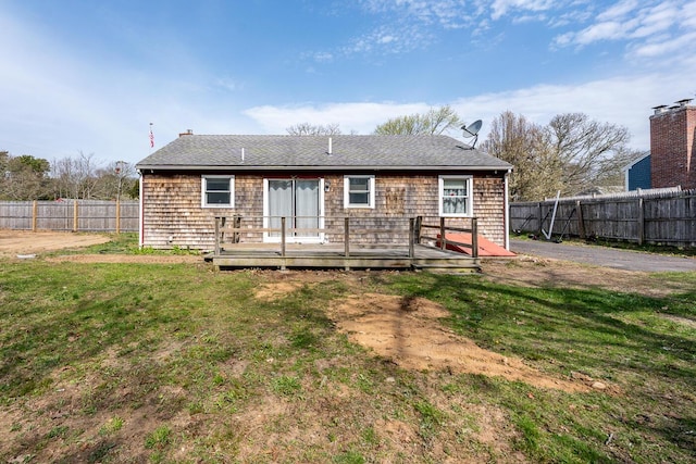 1 Stevens Way, Harwich, MA 02645 - back of property with a deck, a yard, and a fenced backyard