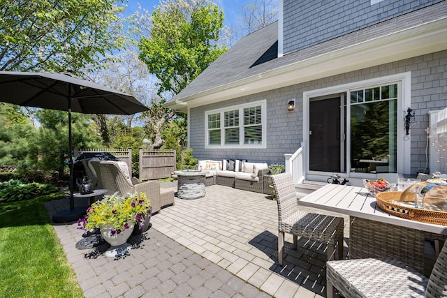 41 Old Main Rd Unit 3Au, North Falmouth, MA 02556 - view of patio with an outdoor living space, fence, and outdoor dining area