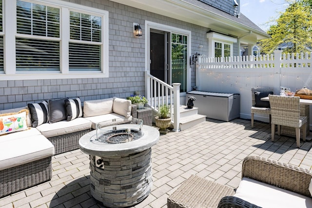 41 Old Main Rd Unit 3Au, North Falmouth, MA 02556 - view of patio with an outdoor living space with a fire pit, fence, and outdoor dining area