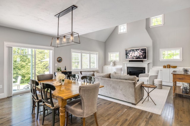 41 Old Main Rd Unit 3Au, North Falmouth, MA 02556 - dining space featuring dark wood finished floors, a fireplace, and high vaulted ceiling