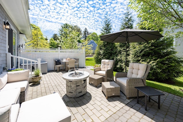 41 Old Main Rd Unit 3Au, North Falmouth, MA 02556 - view of patio / terrace with an outdoor living space with a fire pit and fence