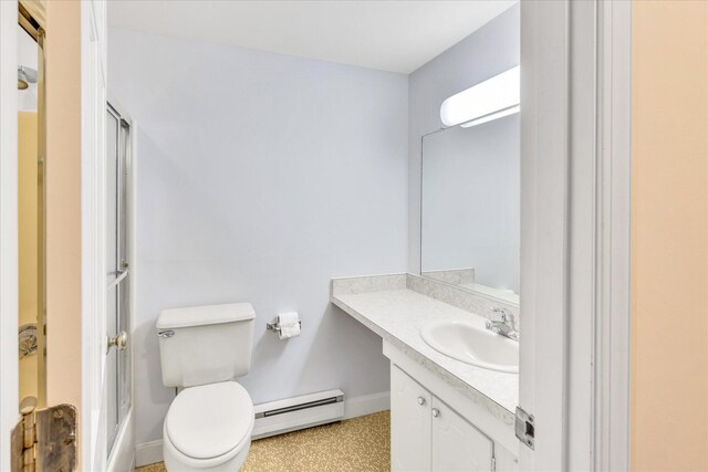 bathroom with baseboard heating, toilet, vanity, and an enclosed shower