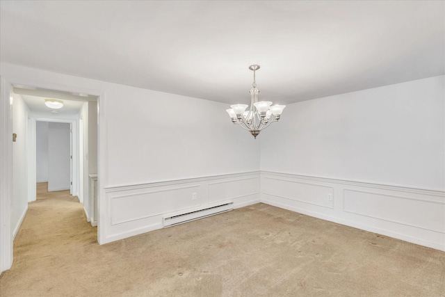 empty room with light carpet, a notable chandelier, and a baseboard heating unit