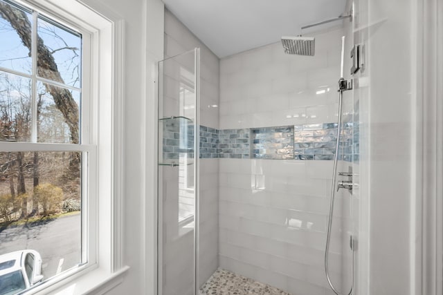 full bath featuring a tile shower