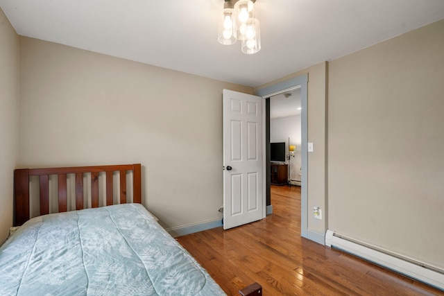 18 Race Rd, West Yarmouth, MA 02673 - bedroom featuring baseboard heating, wood finished floors, and baseboards
