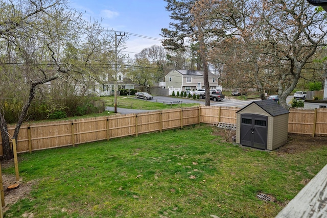 18 Race Rd, West Yarmouth, MA 02673 - view of yard featuring a storage shed, an outdoor structure, and a residential view