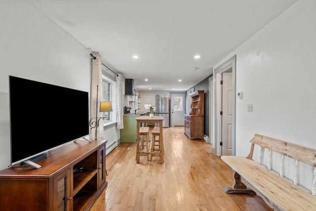 18 Race Rd, West Yarmouth, MA 02673 - living room featuring a baseboard heating unit, light wood finished floors, and recessed lighting