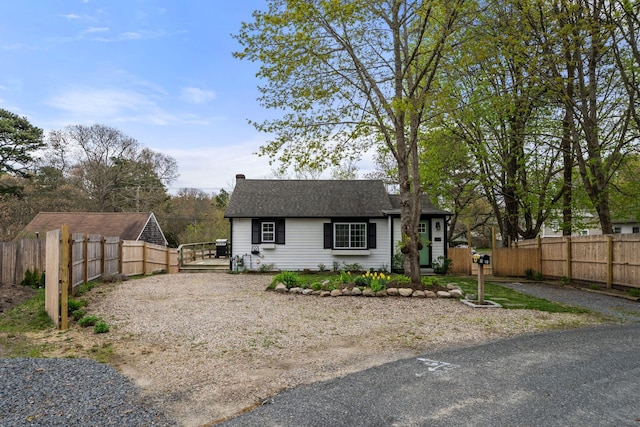 18 Race Rd, West Yarmouth, MA 02673 - view of front facade featuring fence and a shingled roof