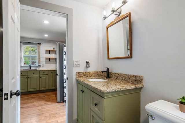 18 Race Rd, West Yarmouth, MA 02673 - bathroom featuring wood finished floors, vanity, toilet, and recessed lighting