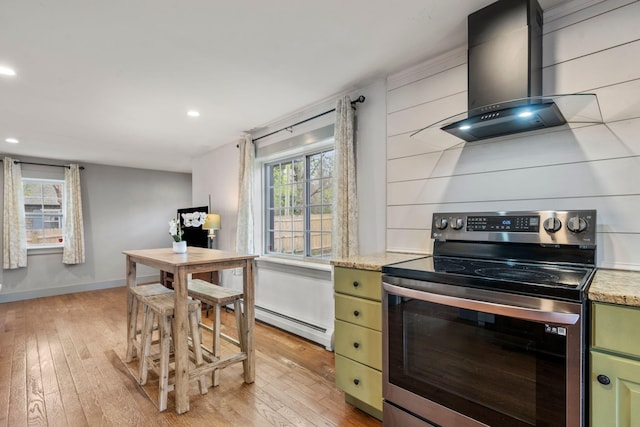 18 Race Rd, West Yarmouth, MA 02673 - kitchen featuring stainless steel range with electric cooktop, wall chimney exhaust hood, a baseboard radiator, light wood-style flooring, and recessed lighting