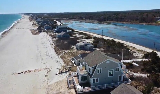 aerial view featuring a water view and a beach view