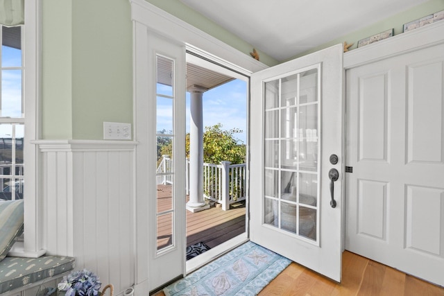 doorway featuring hardwood / wood-style flooring and a wealth of natural light