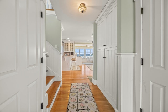 corridor with light wood-type flooring