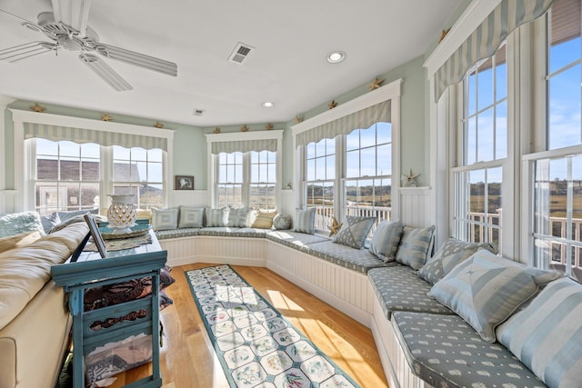 sunroom with ceiling fan