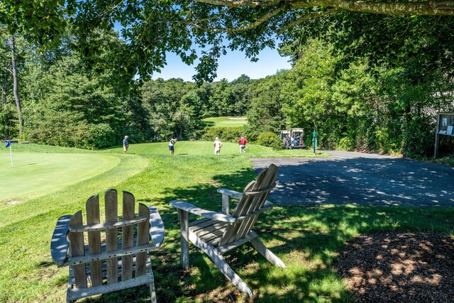 19 Longwood Rd, Mashpee, MA 02649 - view of property's community featuring a yard, an area to practice putting, and golf course view