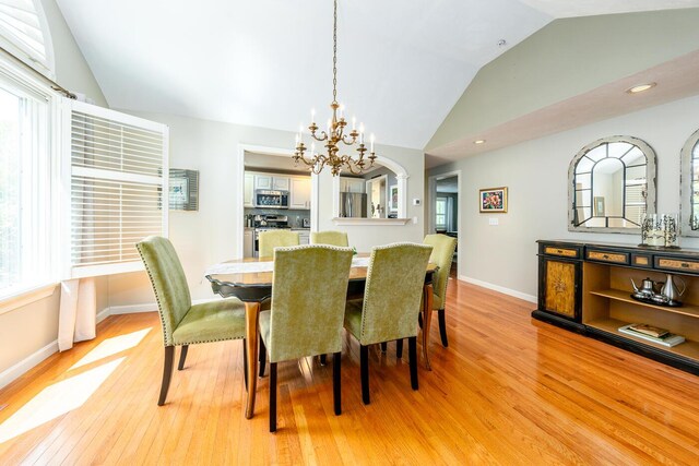 19 Longwood Rd, Mashpee, MA 02649 - dining room featuring lofted ceiling, a chandelier, light wood-style flooring, baseboards, and recessed lighting