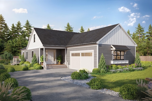21 Josiah Path, West Falmouth, MA 02540 - view of front of house featuring board and batten siding, driveway, an attached garage, and a front yard