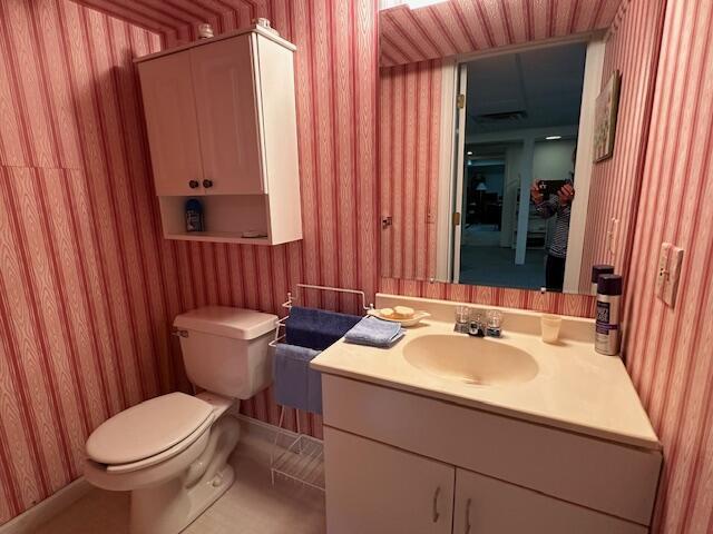 481 Buck Island Rd Unit 17Fa, West Yarmouth, MA 02673 - bathroom featuring wallpapered walls and vanity