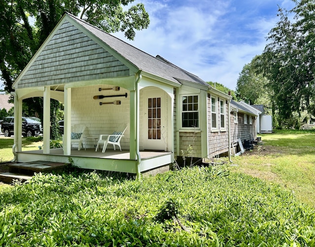 11 Willow Ln, South Yarmouth, MA 02664 - view of side of home featuring a yard, a shingled roof, and a wooden deck