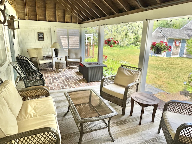 11 Willow Ln, South Yarmouth, MA 02664 - sunroom featuring an outdoor living space with a fire pit and vaulted ceiling