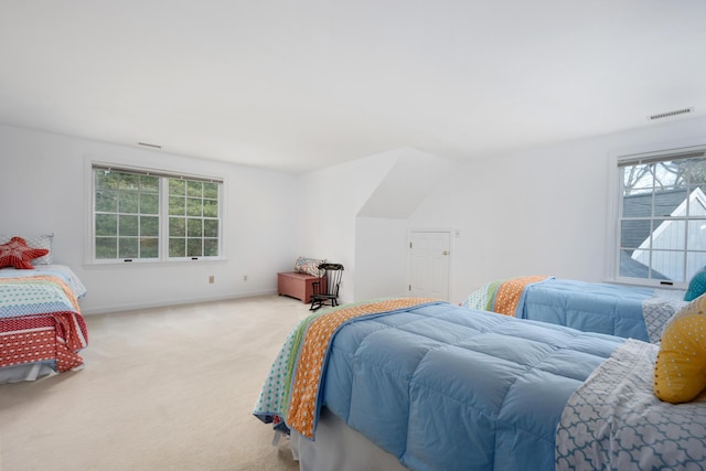 bedroom with carpet flooring and multiple windows