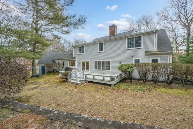 back of house featuring a deck