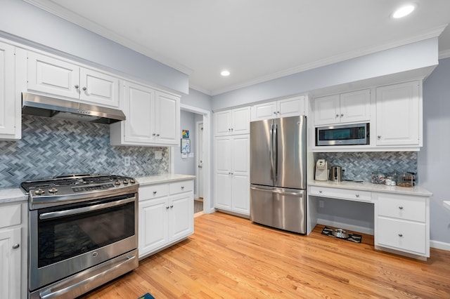 kitchen with white cabinetry, stainless steel appliances, ornamental molding, light hardwood / wood-style floors, and decorative backsplash