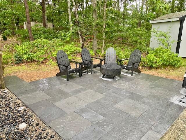 view of patio / terrace with an outbuilding