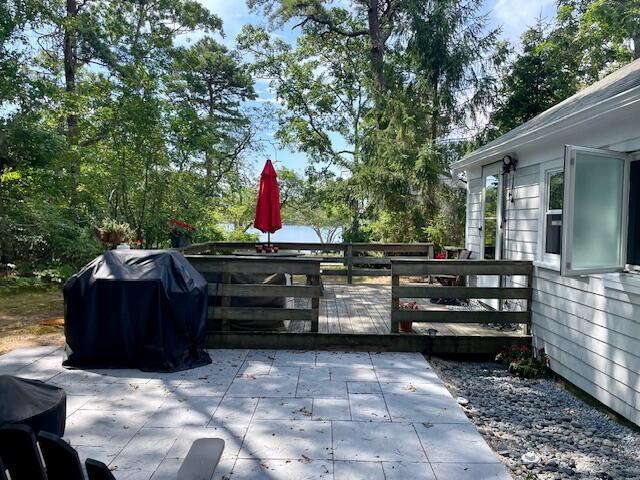 view of patio / terrace featuring a grill and a wooden deck