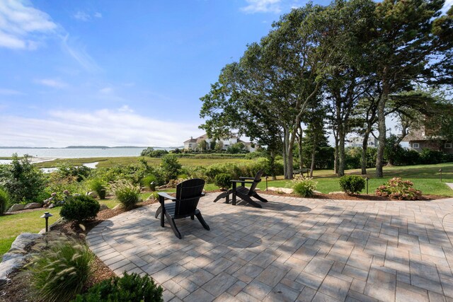 view of patio with a water view