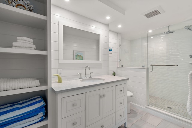 bathroom featuring an enclosed shower, vanity, and toilet