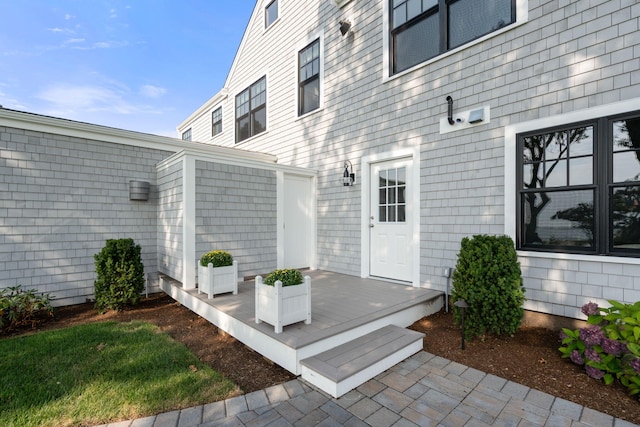 doorway to property with a wooden deck